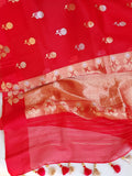 Red organza saree with a contrast blue work blouse