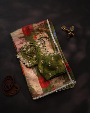 Soft organza saree in green with a beautifully embroidered blouse