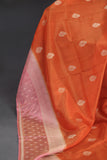 An exquisite Silk Saree in burnt orange and rose pink