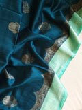Peacock Green with aqua blue rawsilk saree with a stylish blouse