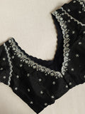 Falling organza saree in black with all over sequins work