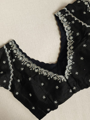 Falling organza saree in black with all over sequins work