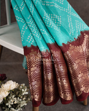 Blue Kanchi Bandini saree with a stunning brown border