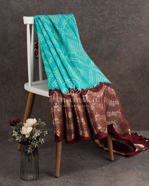 Blue Kanchi Bandini saree with a stunning brown border