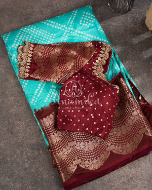 Blue Kanchi Bandini saree with a stunning brown border