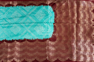 Blue Kanchi Bandini saree with a stunning brown border