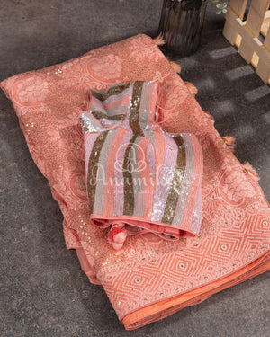 Peach Chikankari Georgette saree with an all over sequins blouse