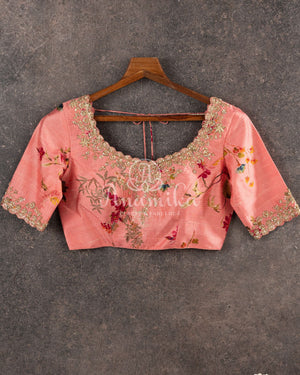 Red Georgette saree with a contrast peach floral blouse