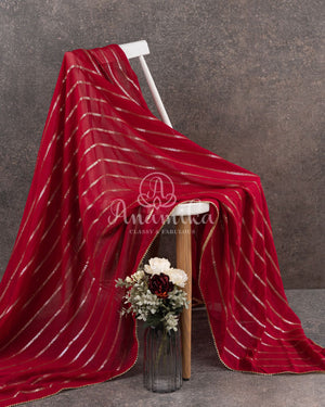 Red Georgette saree with a contrast peach floral blouse