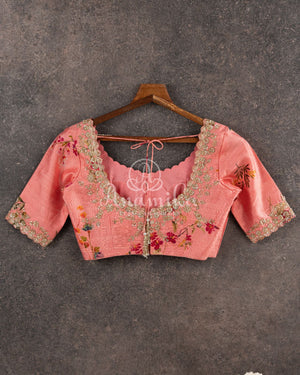 Red Georgette saree with a contrast peach floral blouse