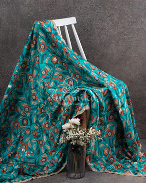 Blue Crepe Silk saree with digital kalamkari print and a beautiful mirror work border