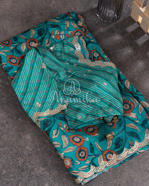 Blue Crepe Silk saree with digital kalamkari print and a beautiful mirror work border