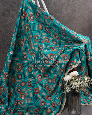 Blue Crepe Silk saree with digital kalamkari print and a beautiful mirror work border