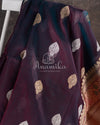 Banarasi Kora Silk saree in a dark purple color with a beautiful floral meenakari border