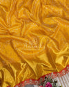 Sunshine Yellow Kanjeevaram saree with a statement maggam work border in orange color