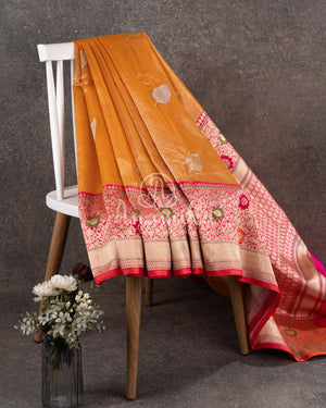 Sandstone Orange Kora Banarasi Tissue saree with a contrast pink blouse