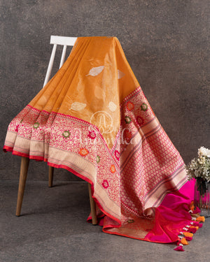 Sandstone Orange Kora Banarasi Tissue saree with a contrast pink blouse