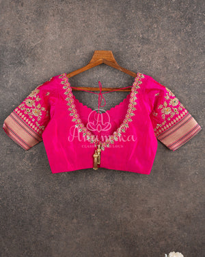 Sandstone Orange Kora Banarasi Tissue saree with a contrast pink blouse