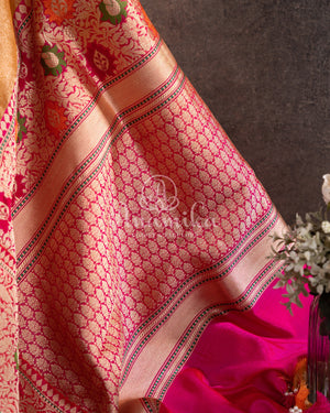 Sandstone Orange Kora Banarasi Tissue saree with a contrast pink blouse