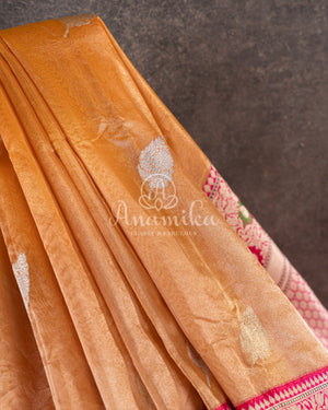 Sandstone Orange Kora Banarasi Tissue saree with a contrast pink blouse