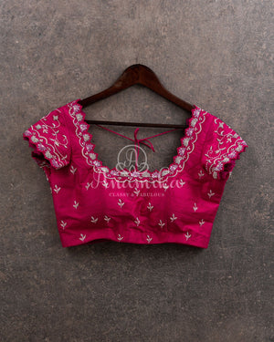 Off white organza saree with a contrast pink work blouse