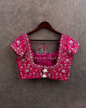 Off white organza saree with a contrast pink work blouse