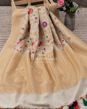 Cream Pure Munga Tusser saree with all over floral meenakari work, paired with a contrast purple blouse