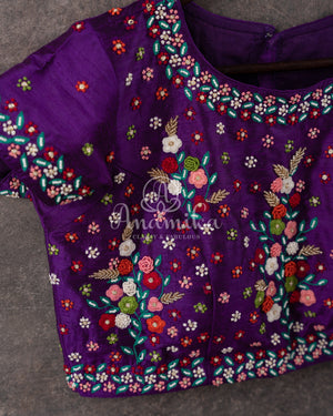 Cream Pure Munga Tusser saree with all over floral meenakari work, paired with a contrast purple blouse
