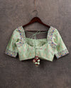 Pastel green ikkat rawsilk blouse with intricately designed multi color thread work