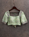 Pastel green ikkat rawsilk blouse with intricately designed multi color thread work