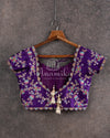 Purple short sleeves blouse with all over multi-color cutdana and pearl work