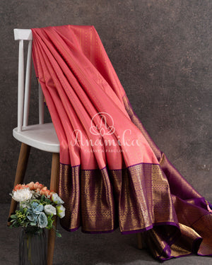 Lovely Peach Kanjeevaram saree with a contrast purple kanchi border
