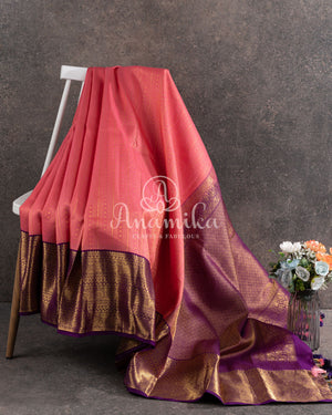 Lovely Peach Kanjeevaram saree with a contrast purple kanchi border
