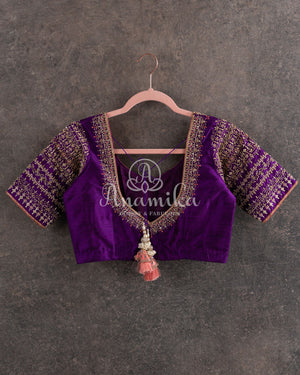 Lovely Peach Kanjeevaram saree with a contrast purple kanchi border