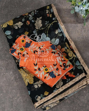 Black Floral georgette saree with a contrast orange 3D flower work blouse