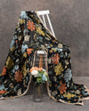 Black Floral georgette saree with a contrast orange 3D flower work blouse