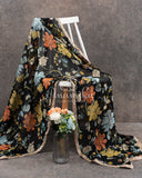 Black Floral georgette saree with a contrast orange 3D flower work blouse