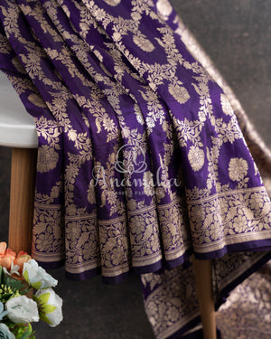 Purple Banarasi Silk Saree with an off white embroidered blouse