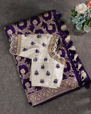 Purple Banarasi Silk Saree with an off white embroidered blouse