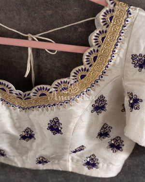Purple Banarasi Silk Saree with an off white embroidered blouse
