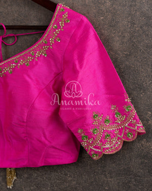 Kanjeevaram saree in pastel green shade paired with a contrast pink blouse