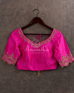 Kanjeevaram saree in pastel green shade paired with a contrast pink blouse