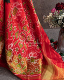 Pure Bandini Silk saree in bottle green with a contrast red patola border