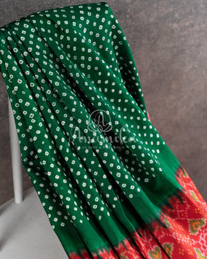 Pure Bandini Silk saree in bottle green with a contrast red patola border