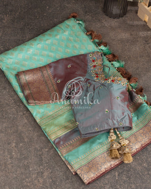 Teal Banarasi Silk Saree with a contrast hand work blouse