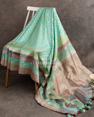 Teal Banarasi Silk Saree with a contrast hand work blouse