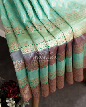 Teal Banarasi Silk Saree with a contrast hand work blouse