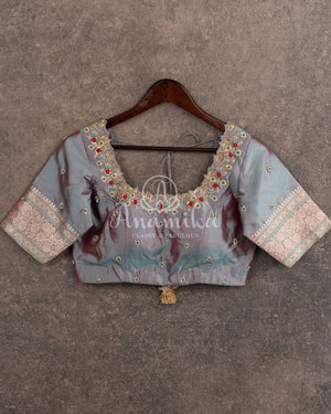 Teal Banarasi Silk Saree with a contrast hand work blouse