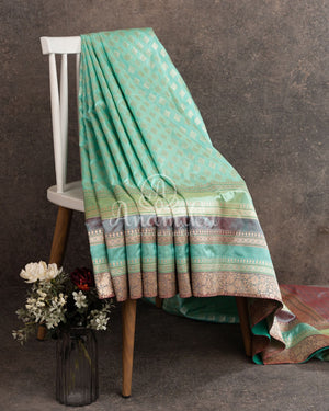 Teal Banarasi Silk Saree with a contrast hand work blouse