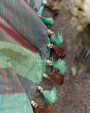 Teal Banarasi Silk Saree with a contrast hand work blouse